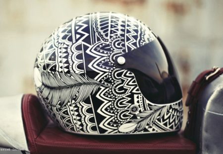 <h3>We've seen that you've "tattooed" helmets. Do you often work in the world of motorcycles?</h3>
We’ve only done it a couple of times. Biking is something that we love and we enjoy diversifying our pastimes. John, the cofounder of 4h10, is a close friend of ours and he asked us to customise his helmet and motorbike. We called it the "Midnight Phoenix" project. After that, Moto Guzzi asked us to work on a V7 for the Paris motorcycle fair and more recently, we did a helmet that was christened "Izanami". They were all random, unique, custom-made orders. 
